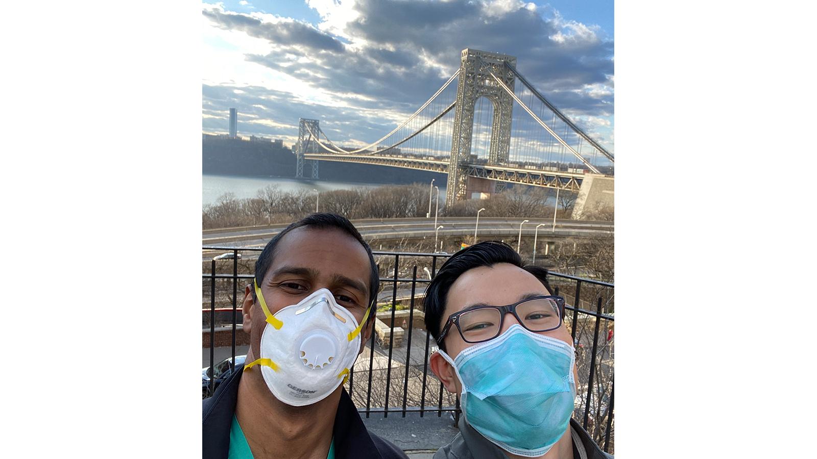 Doctors wearing masks with bridge and river in background