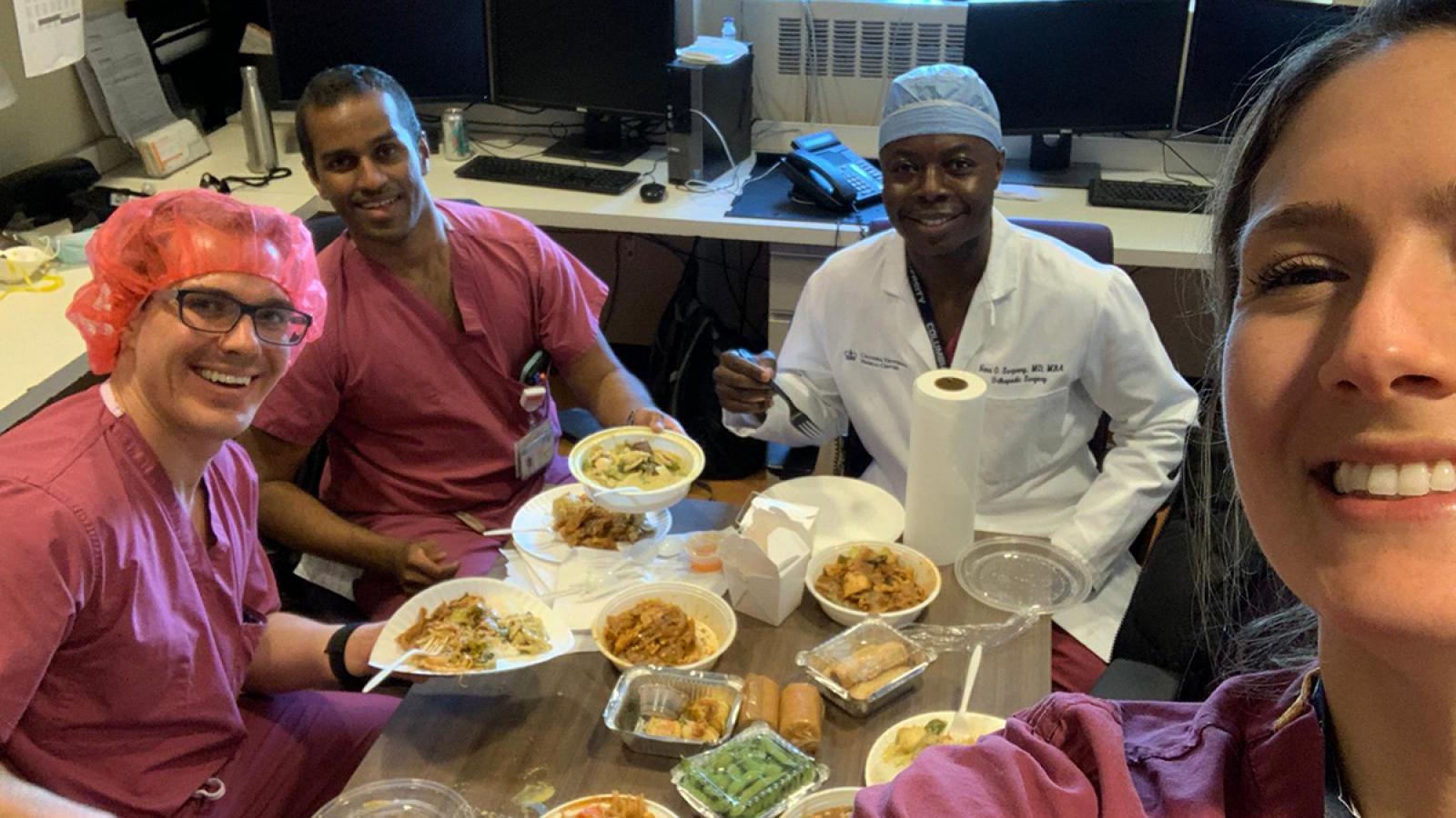 Group of doctors eating take-out