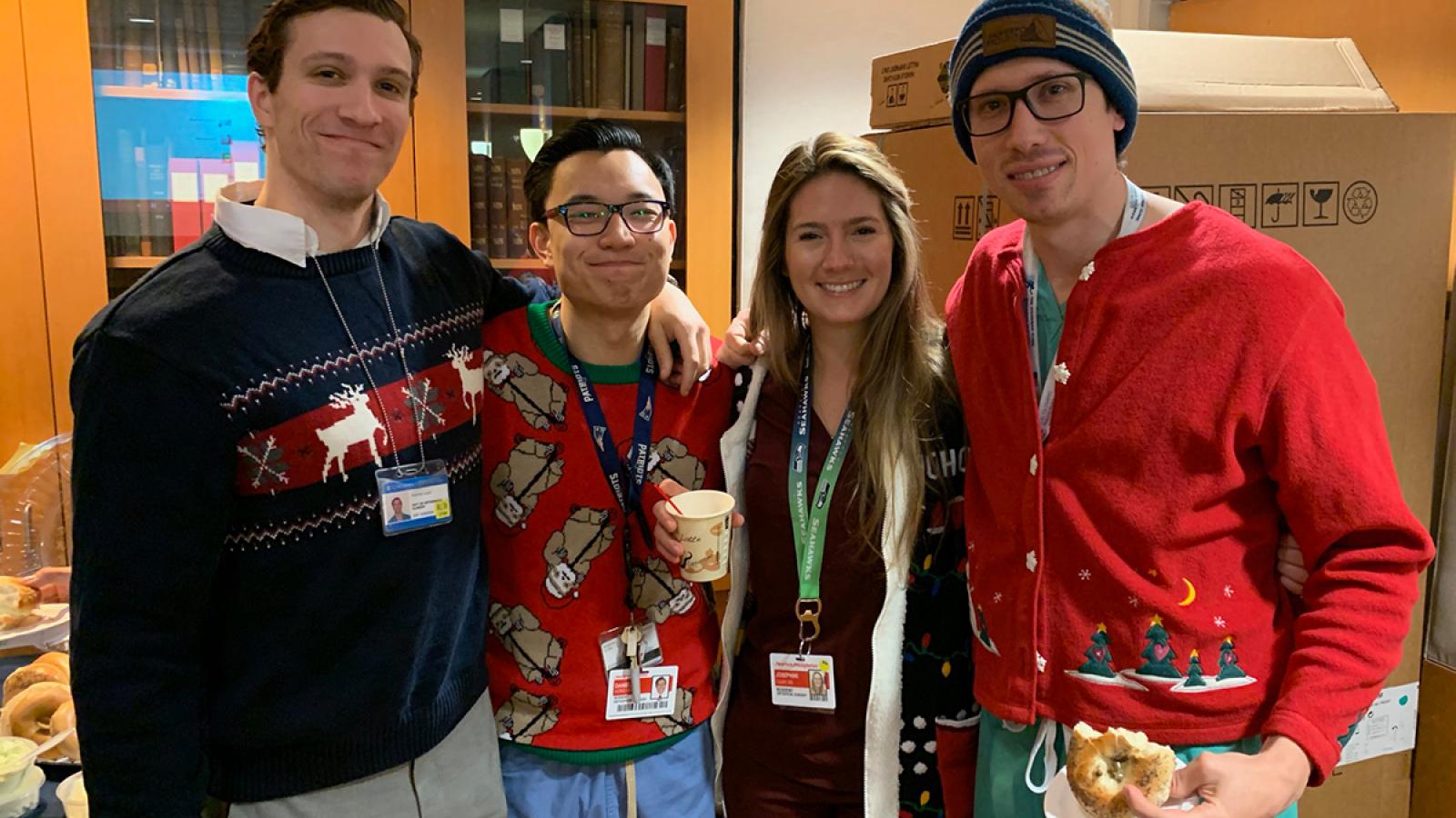 Grou of residents in holiday sweaters.