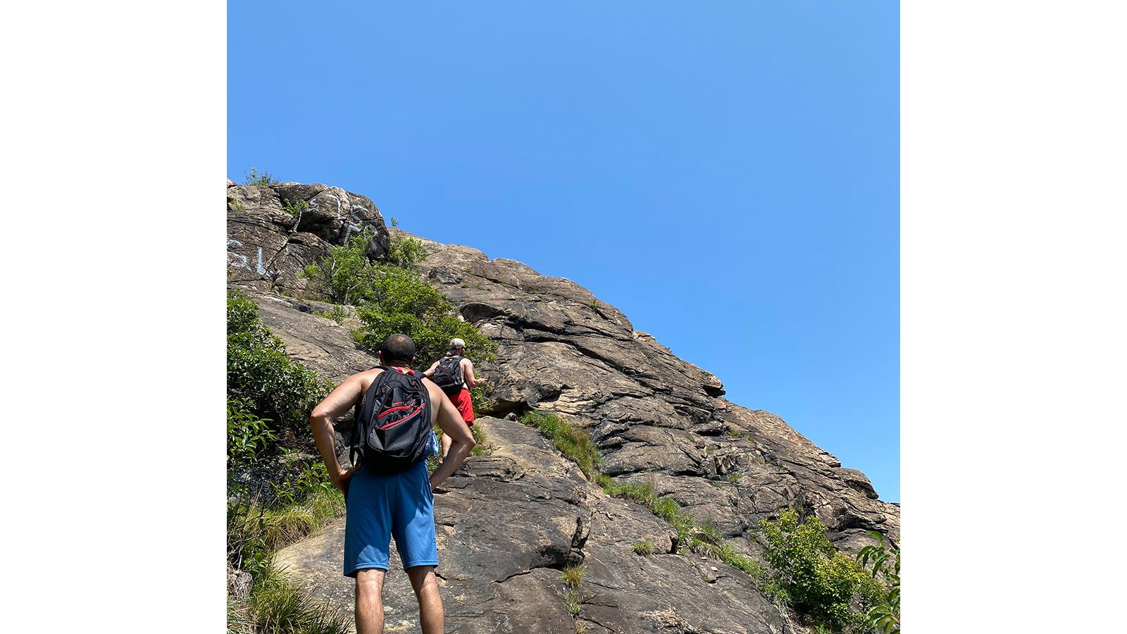 Hikers on rock outcropping