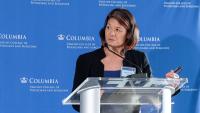 photo of Serena S. Hu, MD, at a translucent podium with a blue and white Columbia step and repeat behind her.