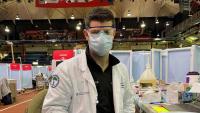 Doctor wearing PPE at mass vaccination clinic