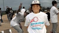 Young baseball player wearing championship tshirt