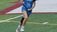 Lauren playing high school lacrosse.