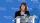 photo of Serena S. Hu, MD, at a translucent podium with a blue and white Columbia step and repeat behind her.
